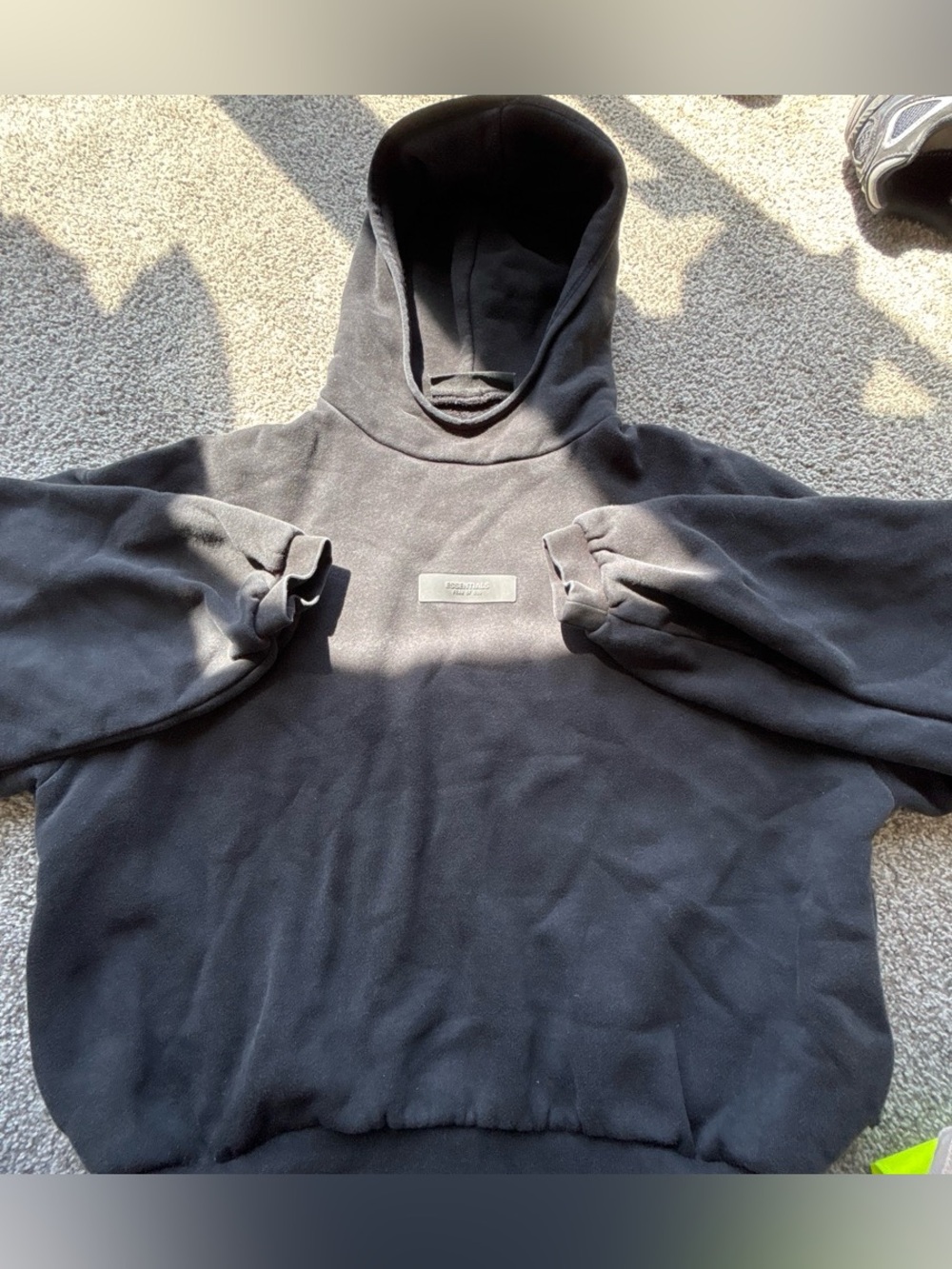 Essentials Black Hoodie with Chest Patch